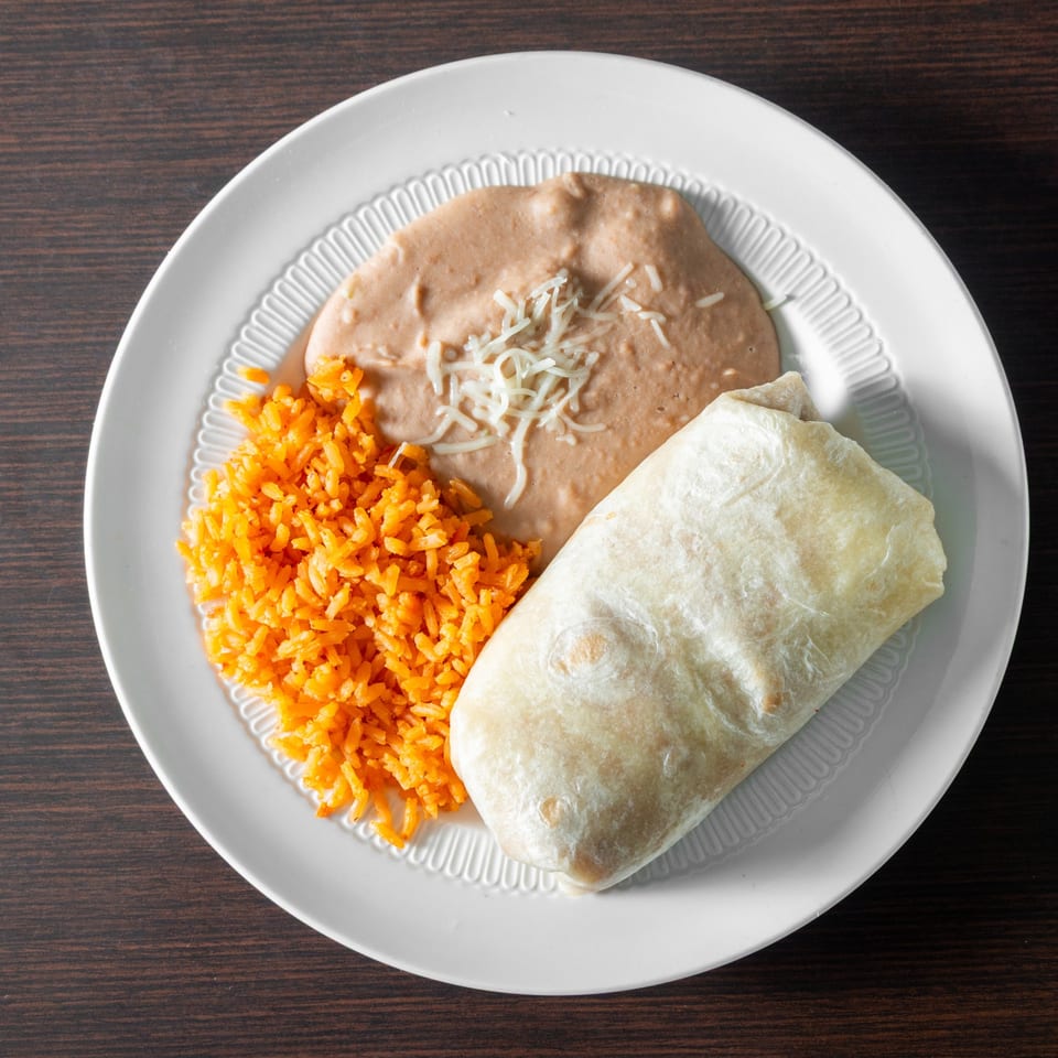 Burrito with rice and refried beans.