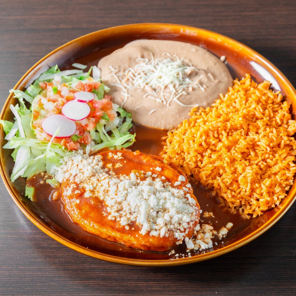 Chile relleno with rice, beans and salad.